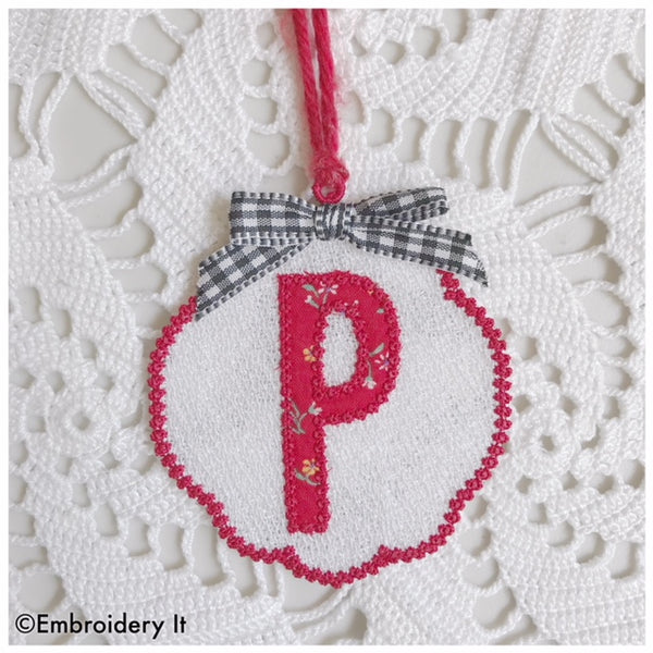Machine embroidery free standing lace design with monogram applique