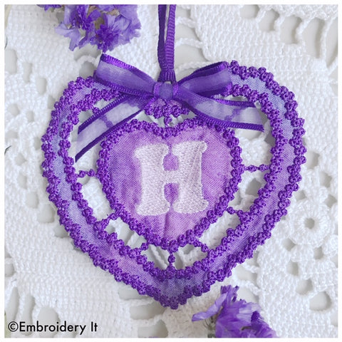 Machine embroidery cutwork monogram heart design