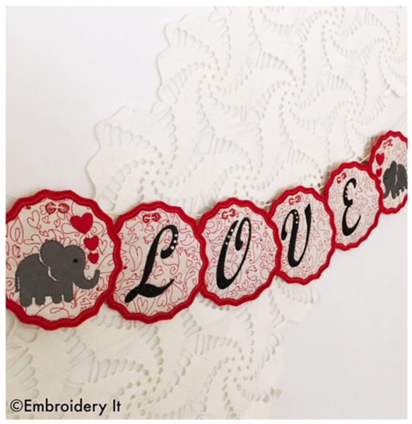 Machine embroidery in the hoop love banner